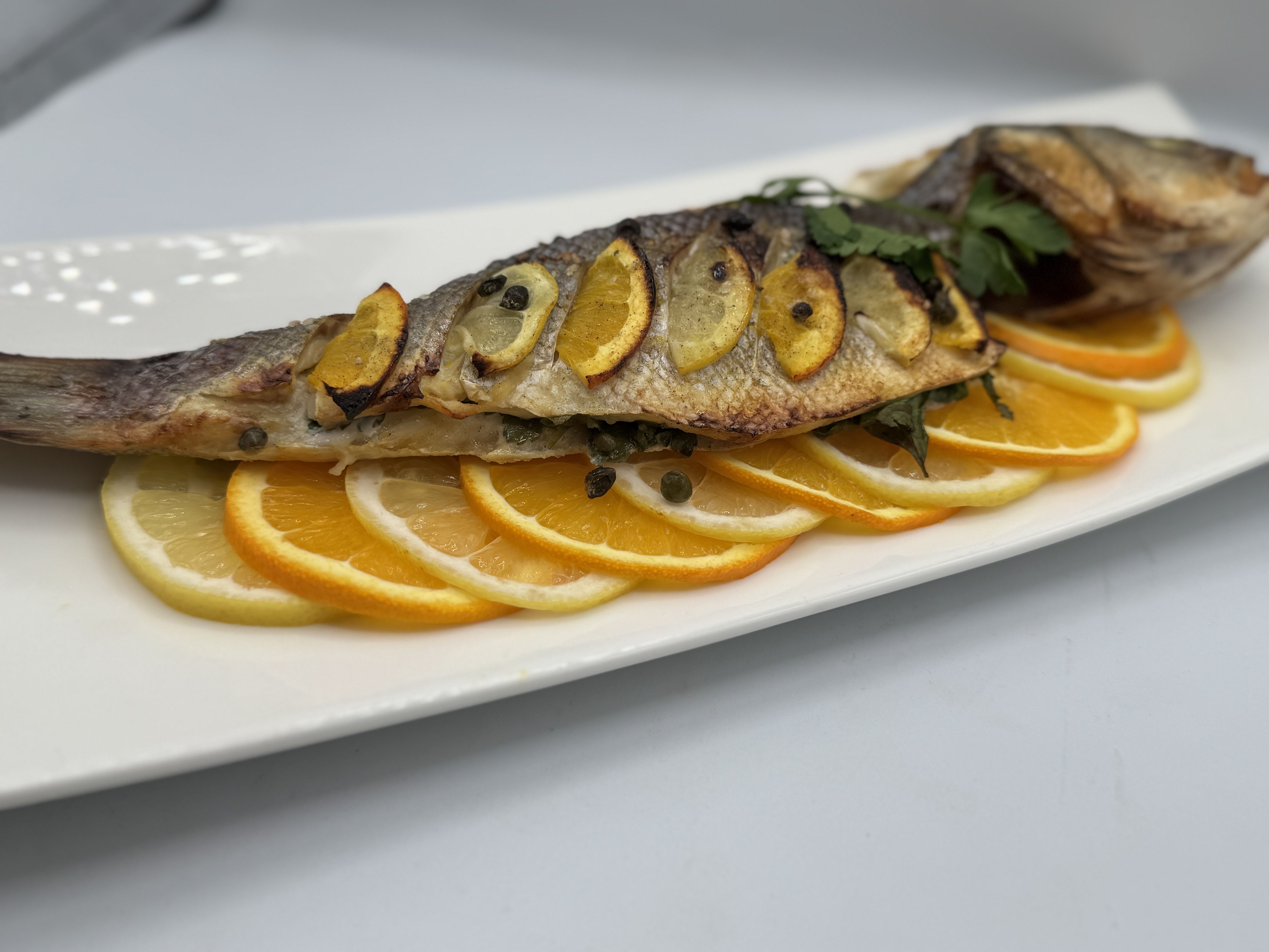 Whole Citrus Grilled Roasted Branzino with Oranges, Lemons and Capers