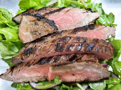 Individual Marinated Beef Platter over Arugula Tomato Salad